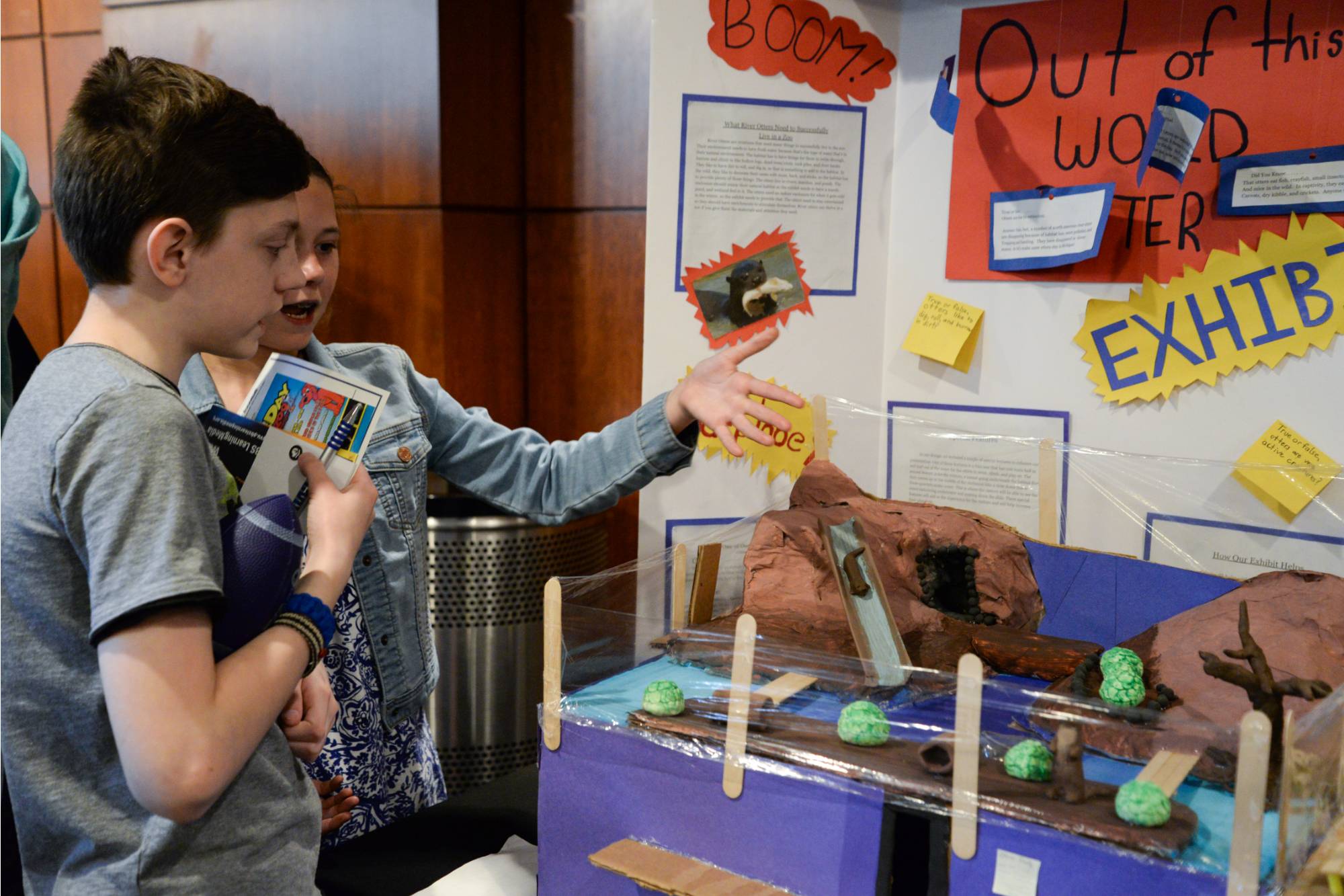 Students explaining their Showcase display